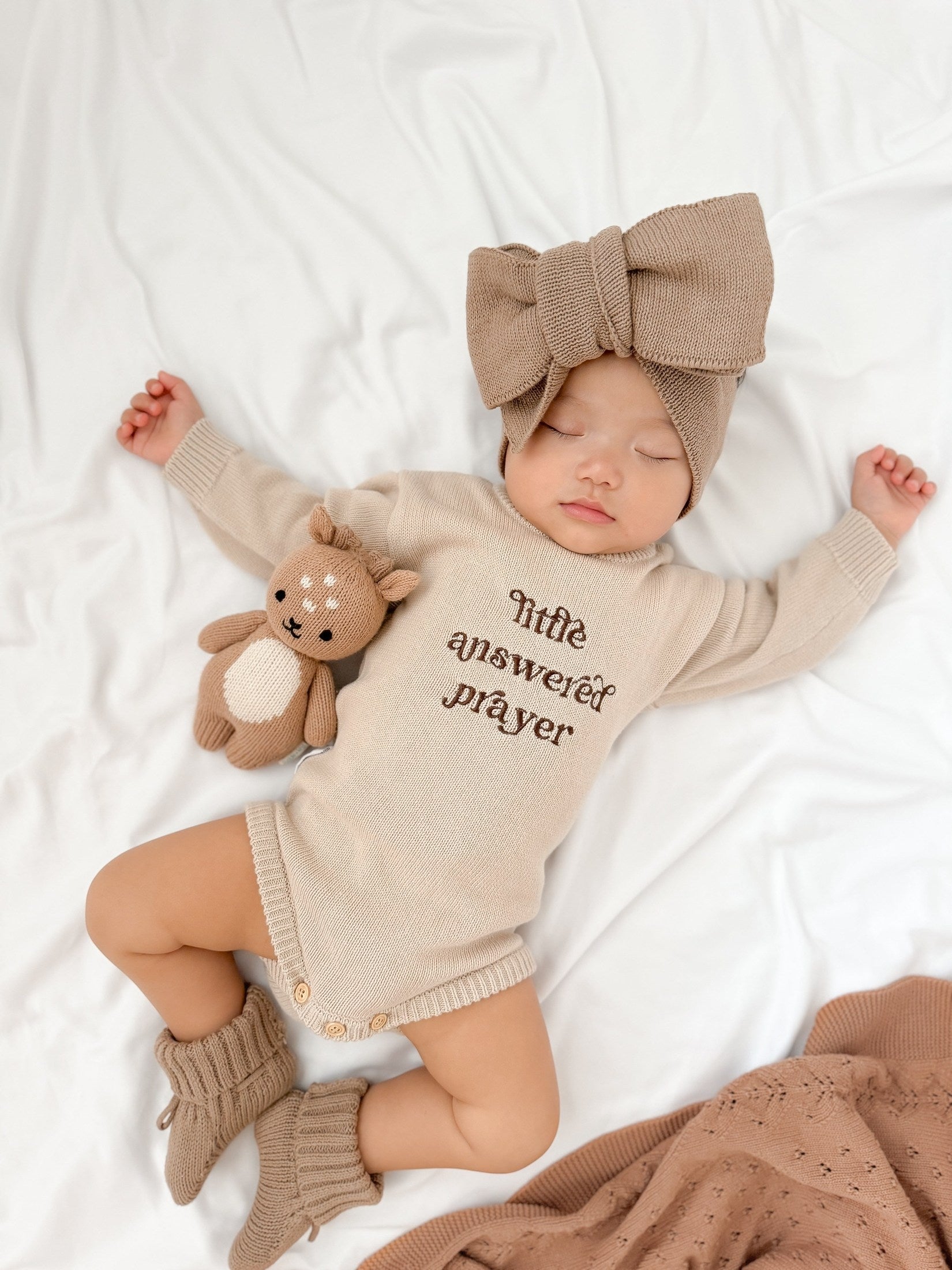 Newborn wearing Little Answered Prayer long-sleeve romper — natural beige cotton knit — Brave Little Lamb