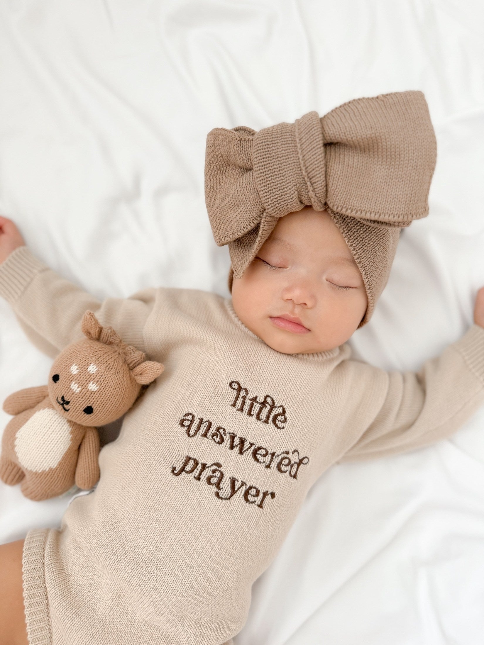 Newborn wearing Little Answered Prayer long-sleeve romper — natural beige cotton knit — Brave Little Lamb