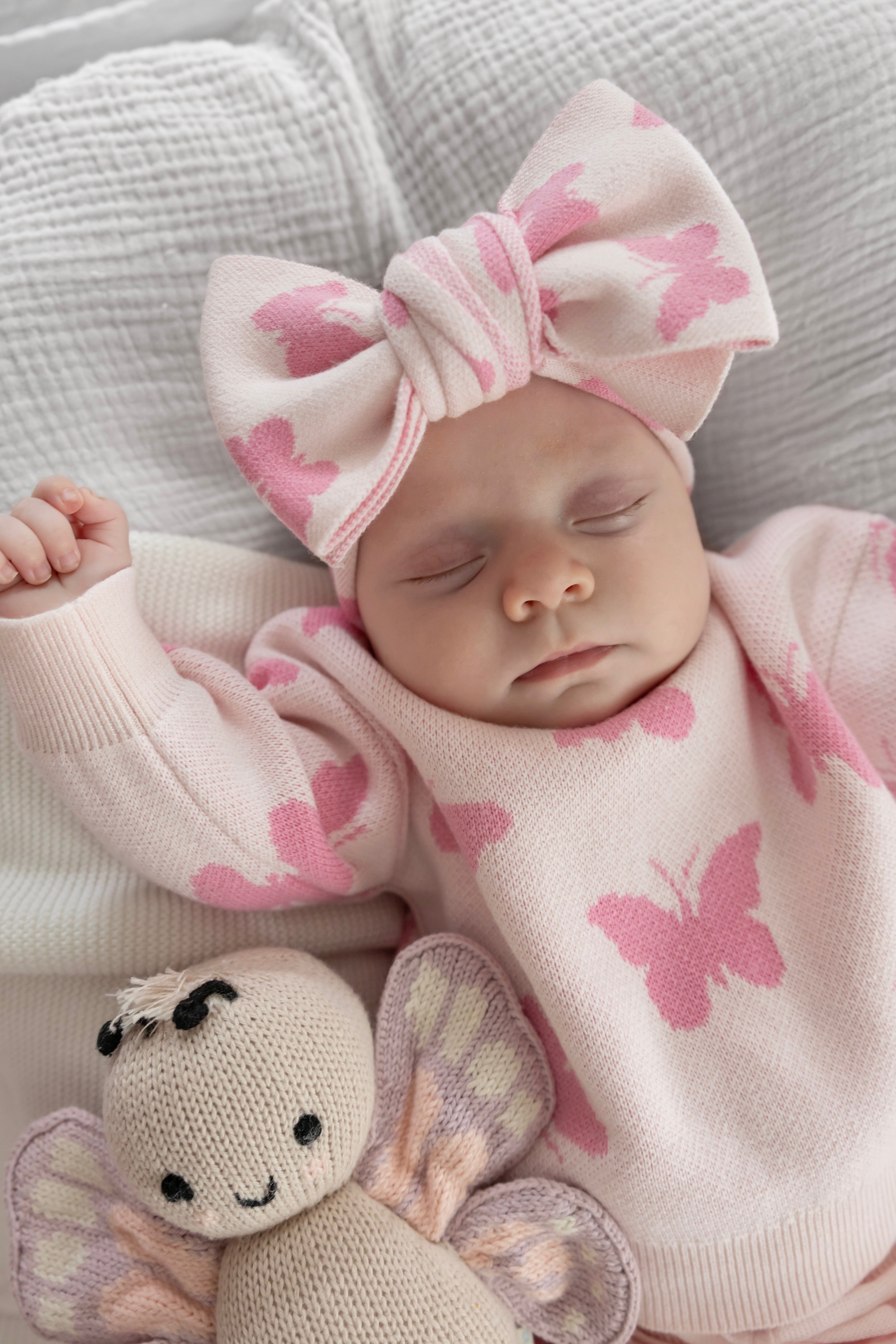 Baby sleeping in Flutter and Frill butterfly sweater — Brave Little Lamb