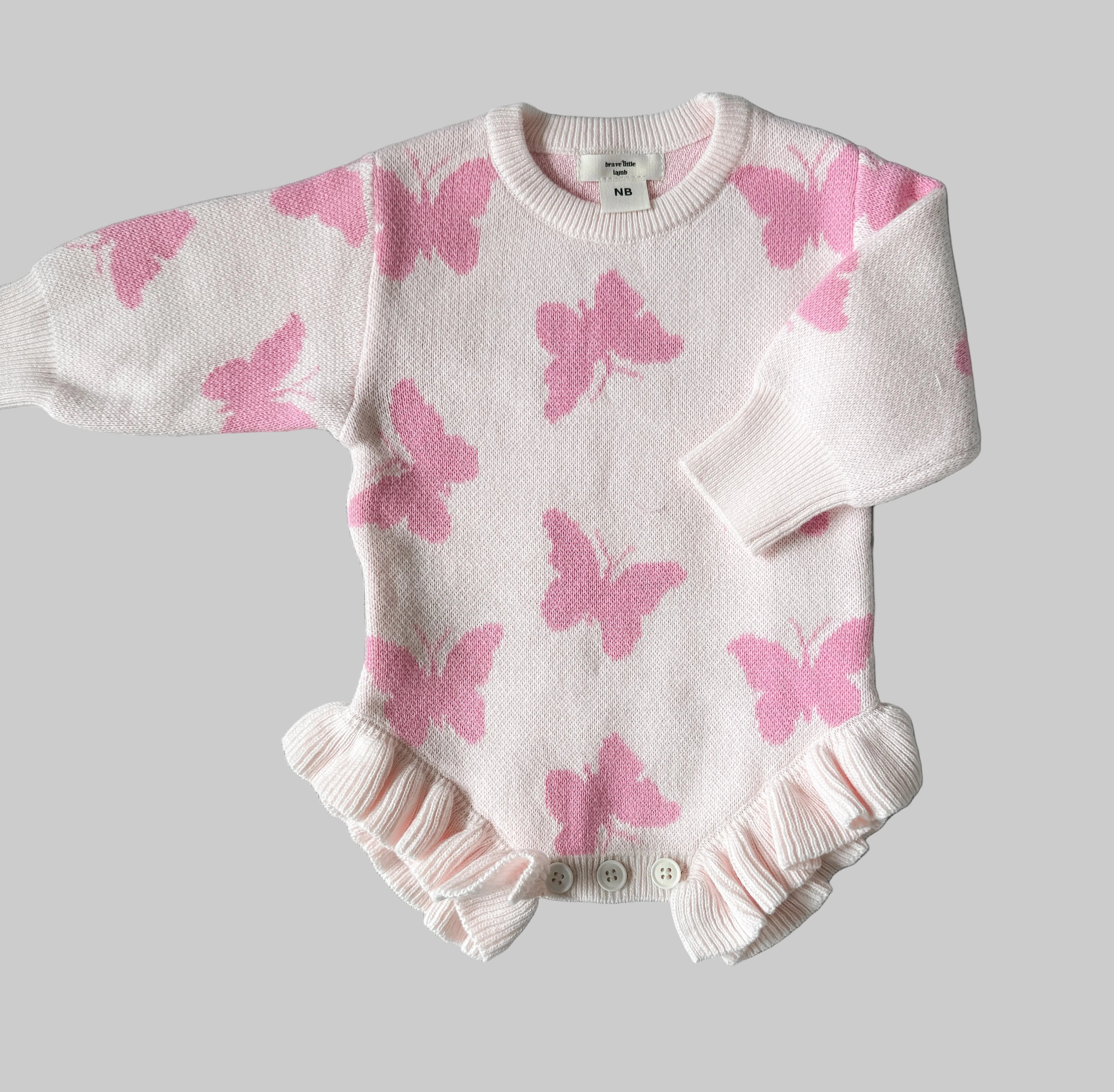 Flutter and Frills Knit Romper flat lay showing 100% cotton construction — Brave Little Lamb