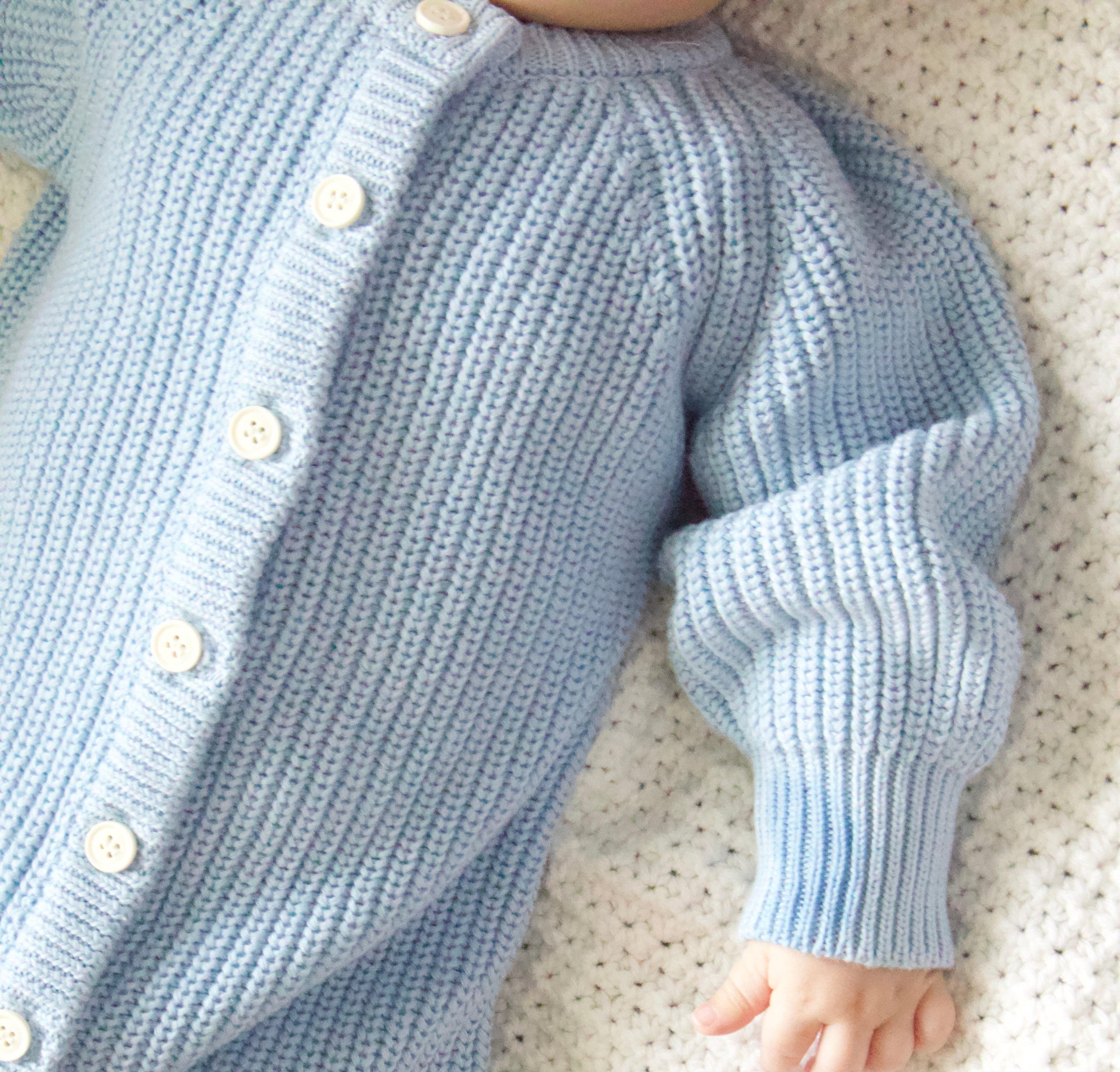 Keepsake Knit Romper showing thick cuffs and relaxed bodice detail on baby — Brave Little Lamb