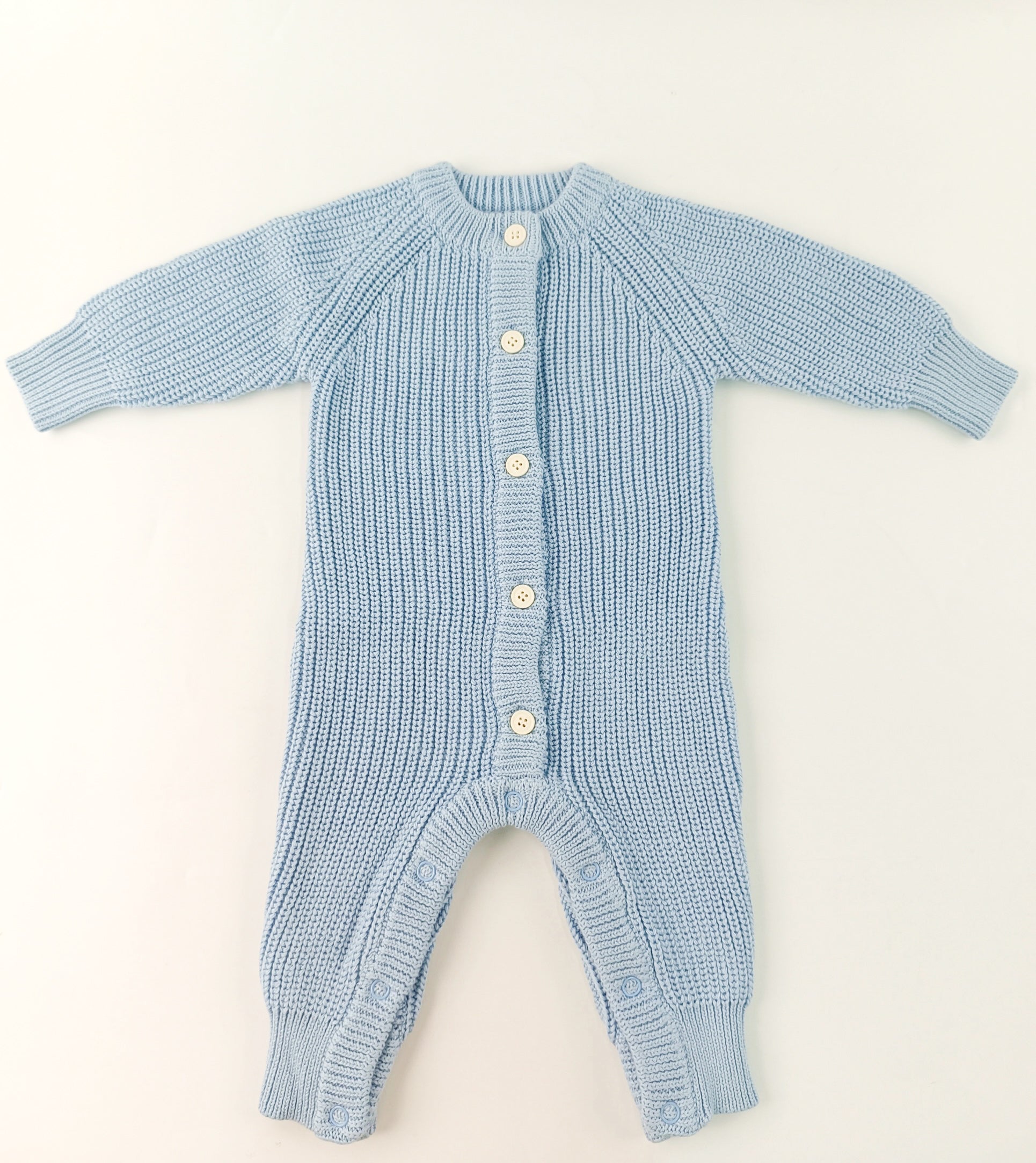 Keepsake Knit Romper flat lay showing snap closures and 100% cotton knit construction — Brave Little Lamb