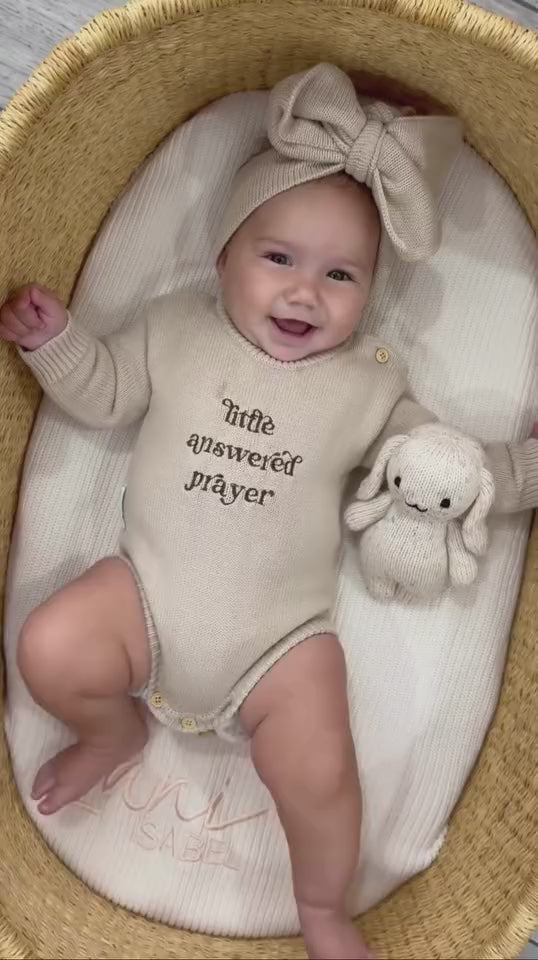 Newborn wearing Little Answered Prayer long-sleeve romper — natural beige cotton knit — Brave Little Lamb