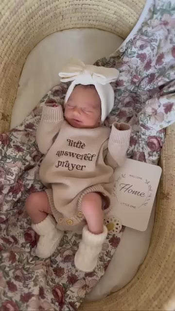 Newborn wearing Little Answered Prayer long-sleeve romper — natural beige cotton knit — Brave Little Lamb