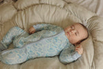 Video of Baby resting in Coastal Camo Zip Footie sleeper — Brave Little Lamb