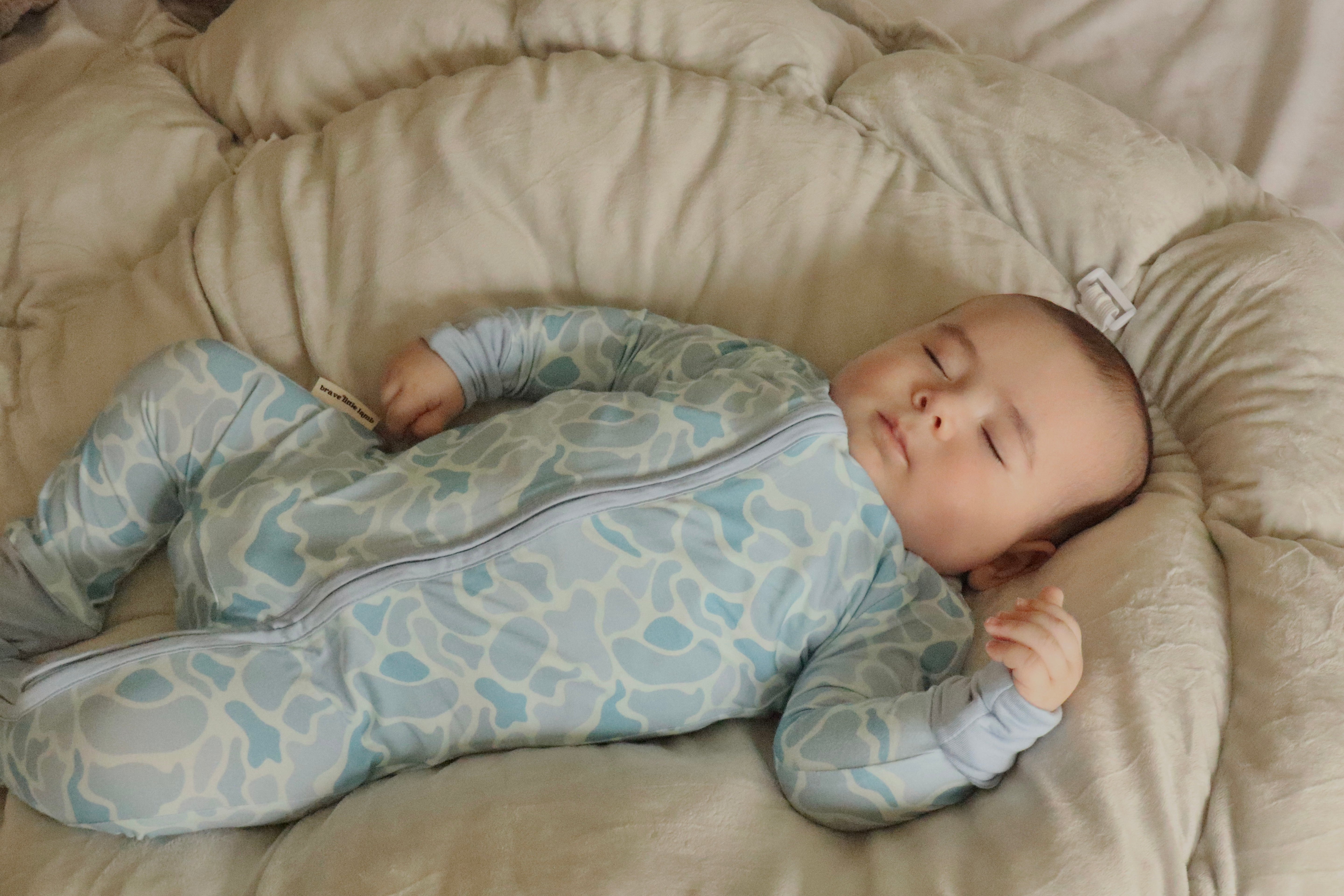 Video of Baby resting in Coastal Camo Zip Footie sleeper — Brave Little Lamb