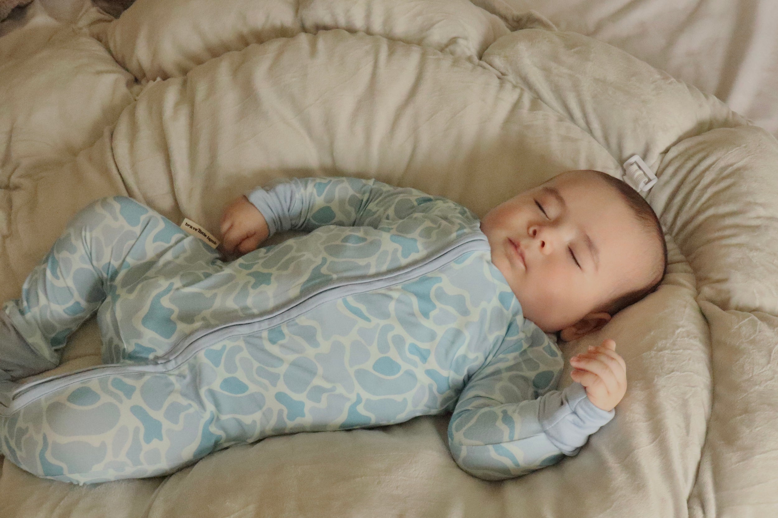 Video of Baby resting in Coastal Camo Zip Footie sleeper — Brave Little Lamb